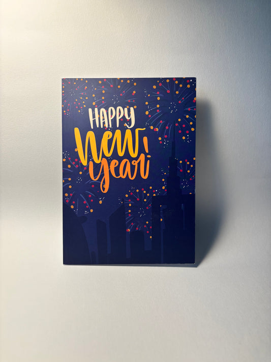 Canvas print with 'Happy New Year' text and fireworks design on a dark blue background.